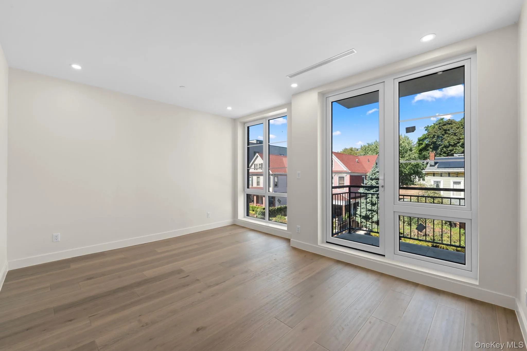 Unfurnished room featuring light wood finished floors and recessed lighting Unfurnished room featuring light wood finished floors and recessed lighting