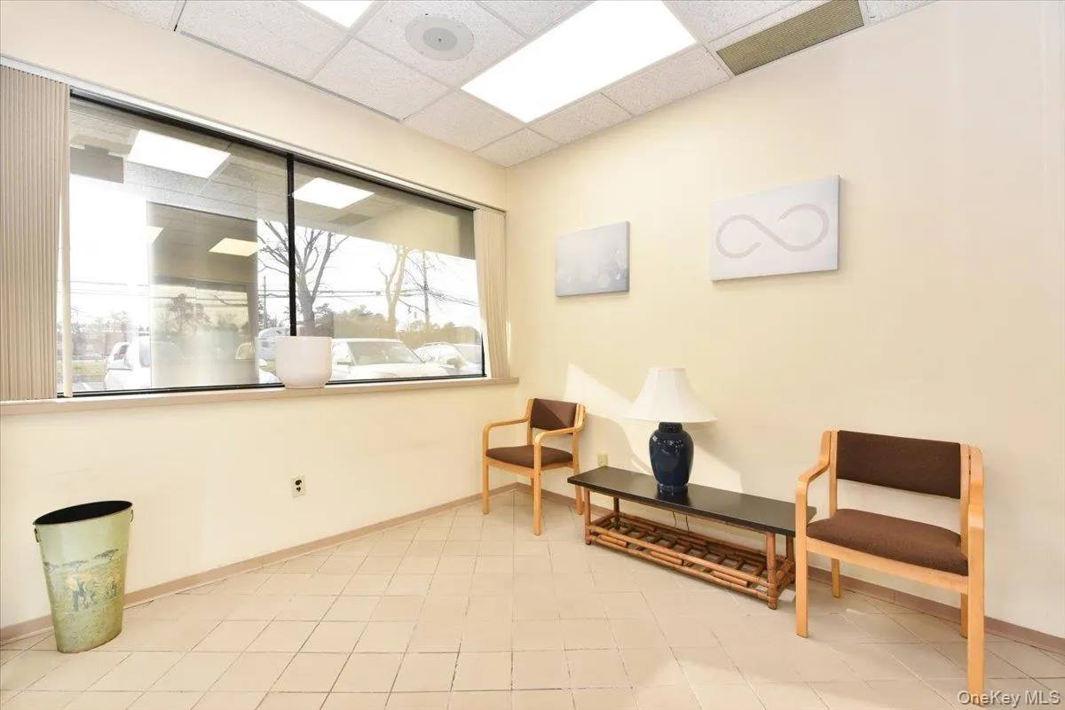 Sitting room featuring a drop ceiling Sitting room featuring a drop ceiling