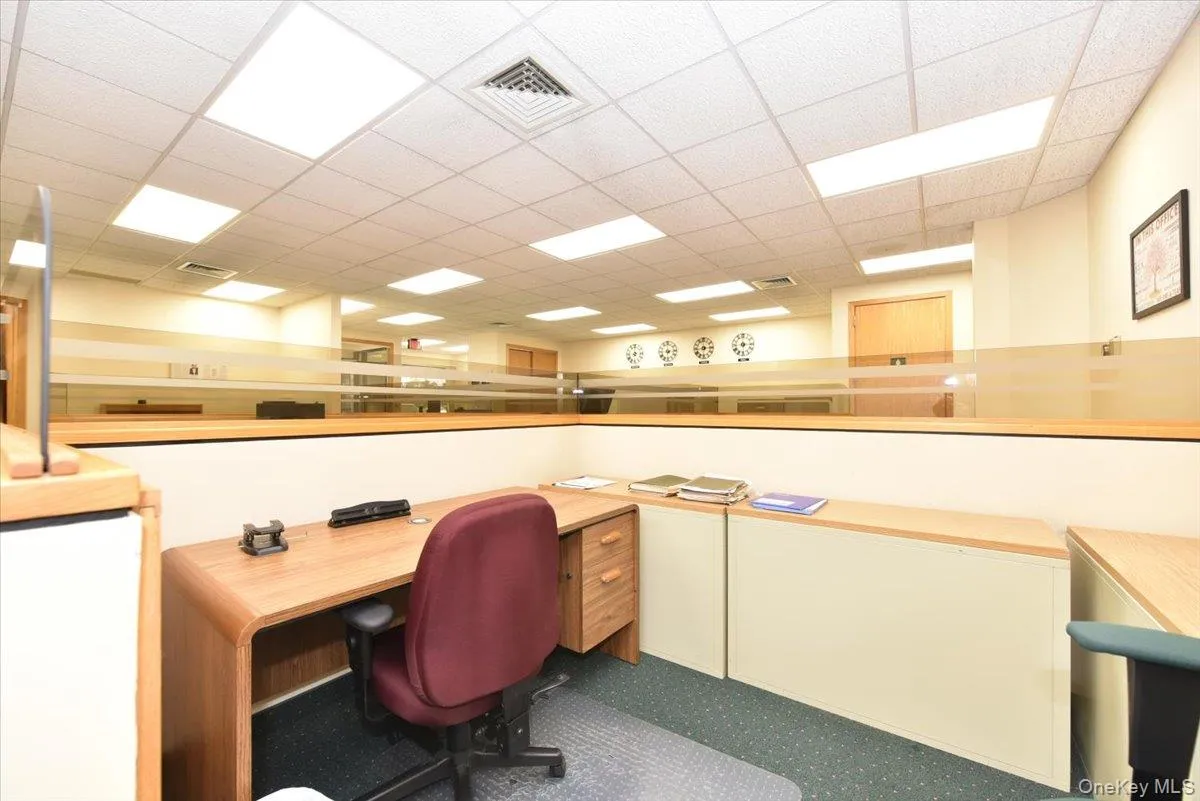Office space featuring a paneled ceiling Office space featuring a paneled ceiling