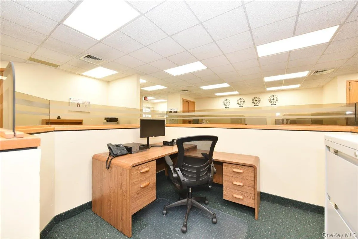 Office space with a drop ceiling and washer / clothes dryer Office space with a drop ceiling and washer / clothes dryer