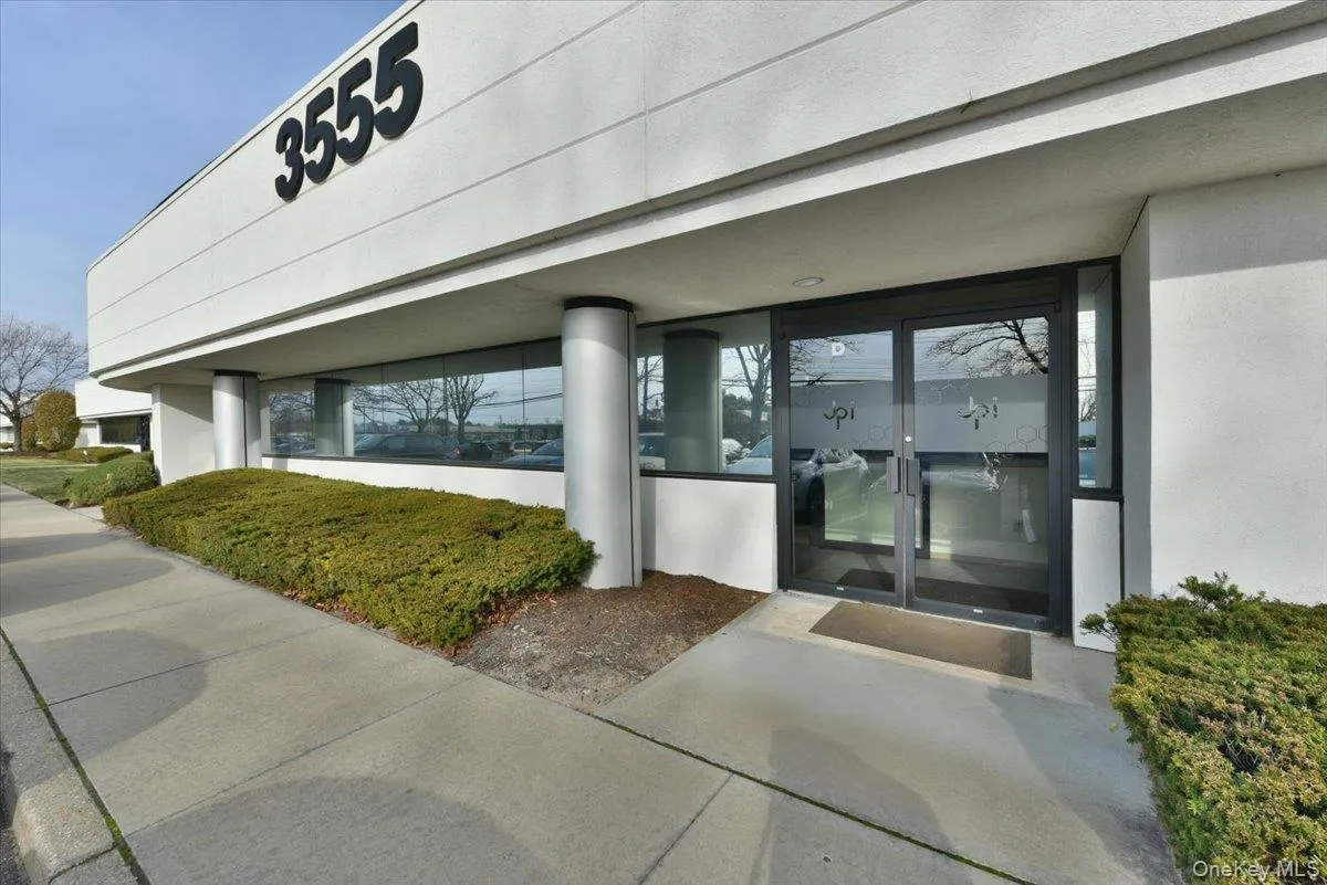 Doorway to property featuring stucco siding and french doors Doorway to property featuring stucco siding and french doors