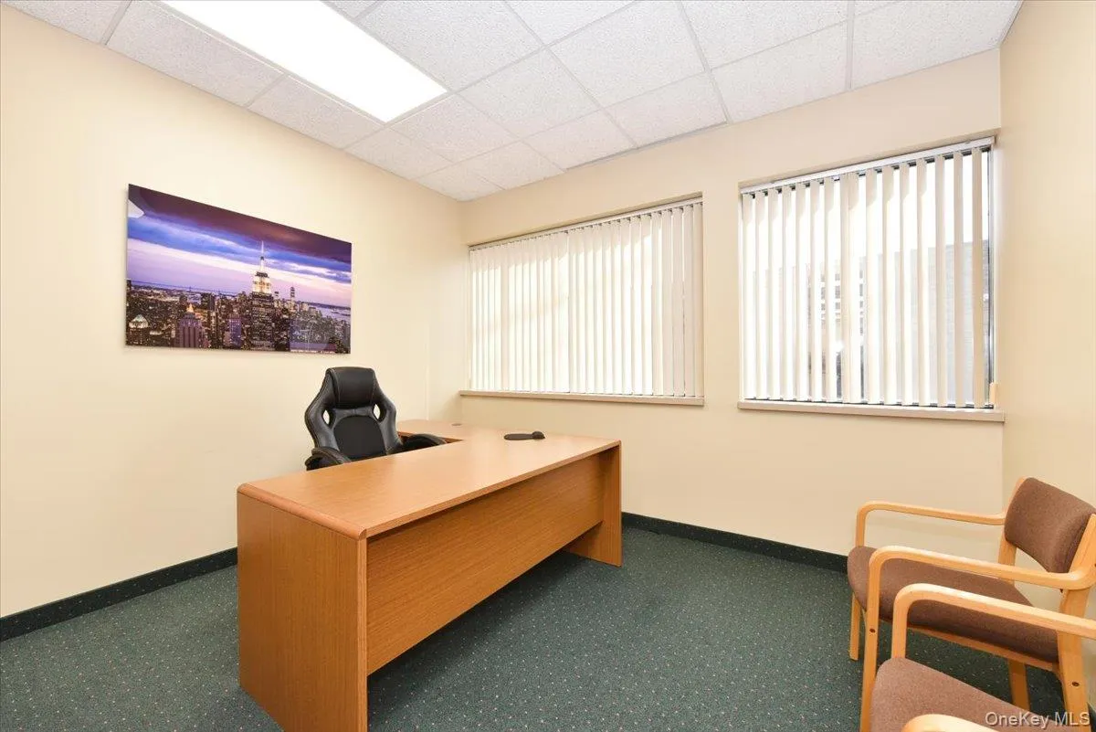 Office space with a paneled ceiling Office space with a paneled ceiling