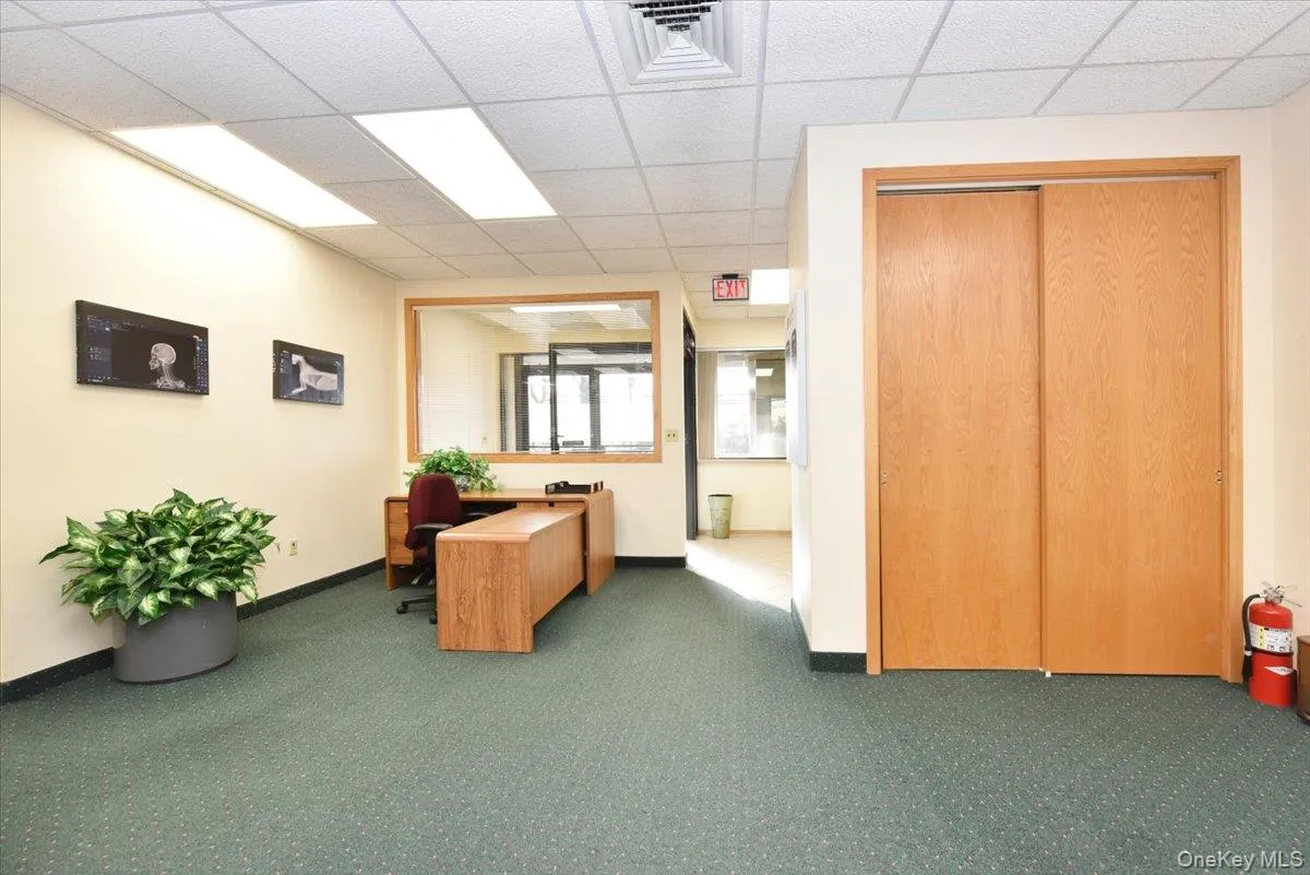 Office space with a paneled ceiling Office space with a paneled ceiling