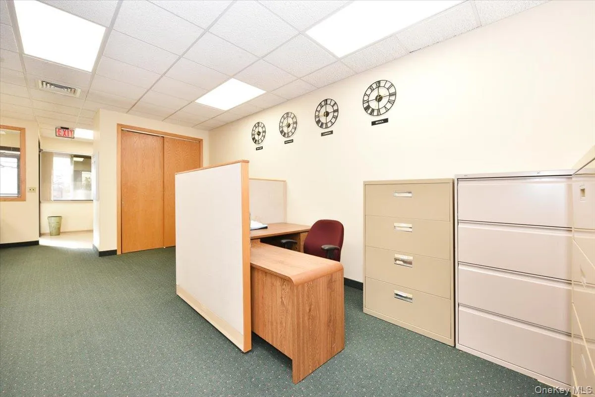 Office with a paneled ceiling Office with a paneled ceiling