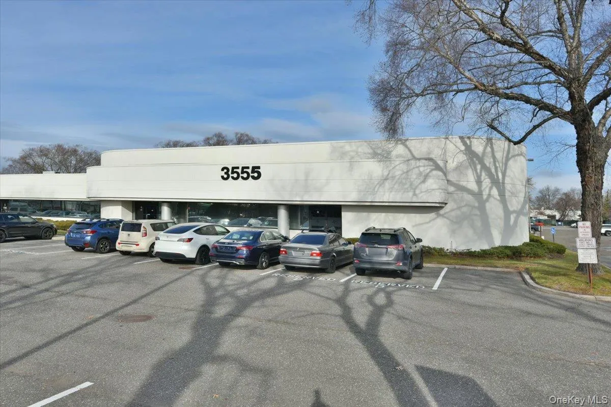 View of commercial property featuring uncovered parking View of commercial property featuring uncovered parking