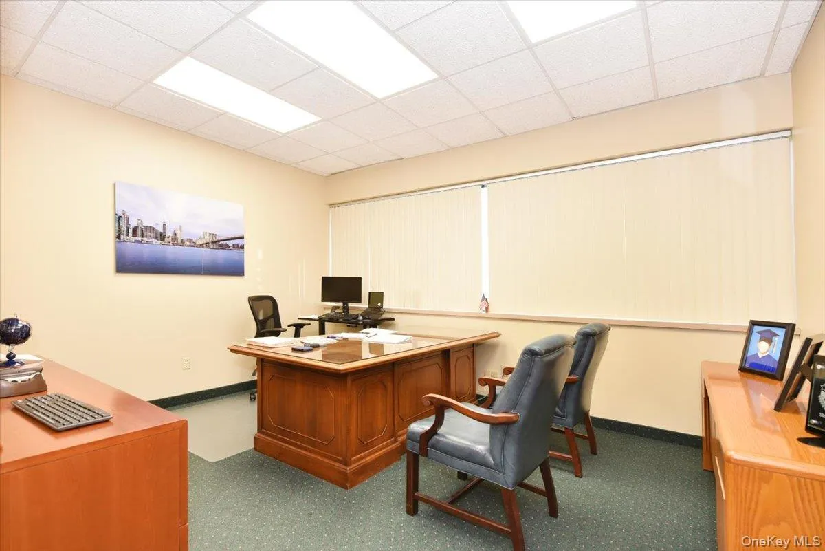 Office space featuring a paneled ceiling Office space featuring a paneled ceiling