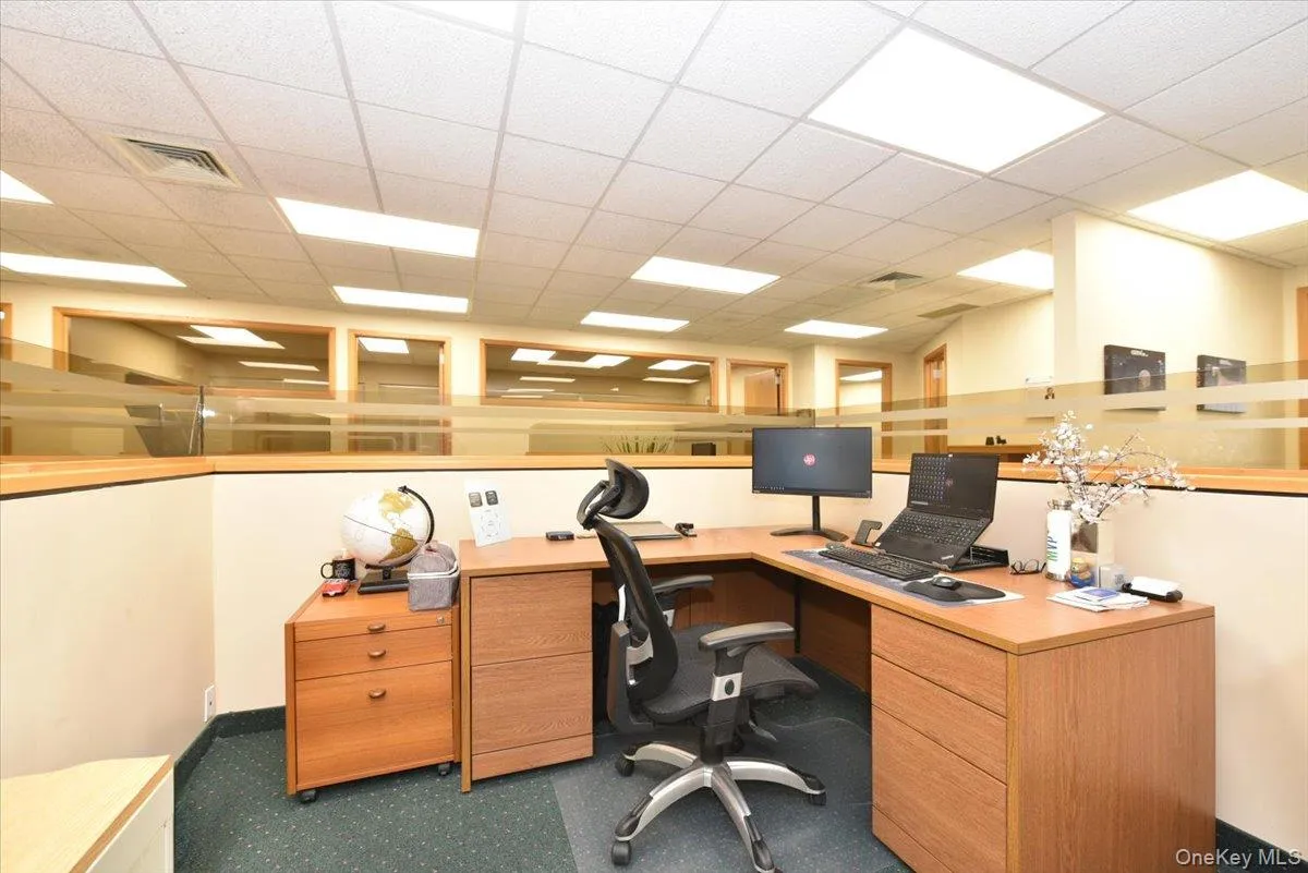 Office area featuring a paneled ceiling Office area featuring a paneled ceiling