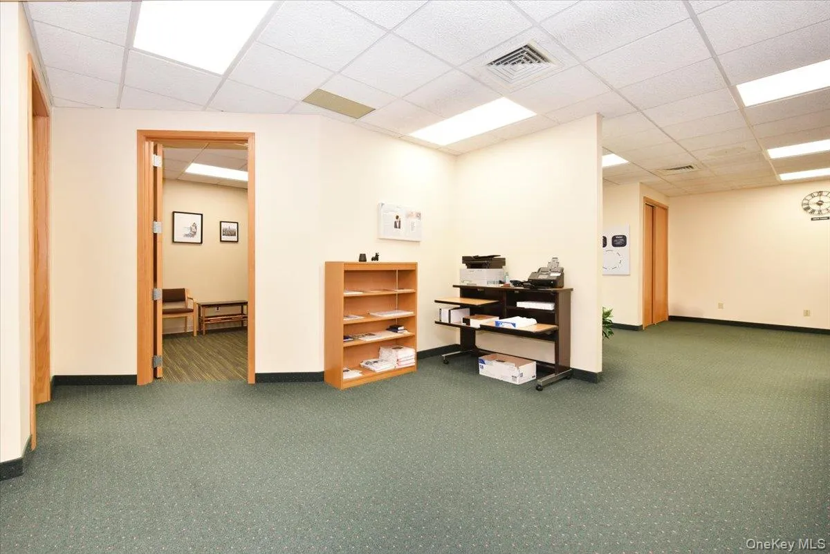 Office area featuring a paneled ceiling Office area featuring a paneled ceiling