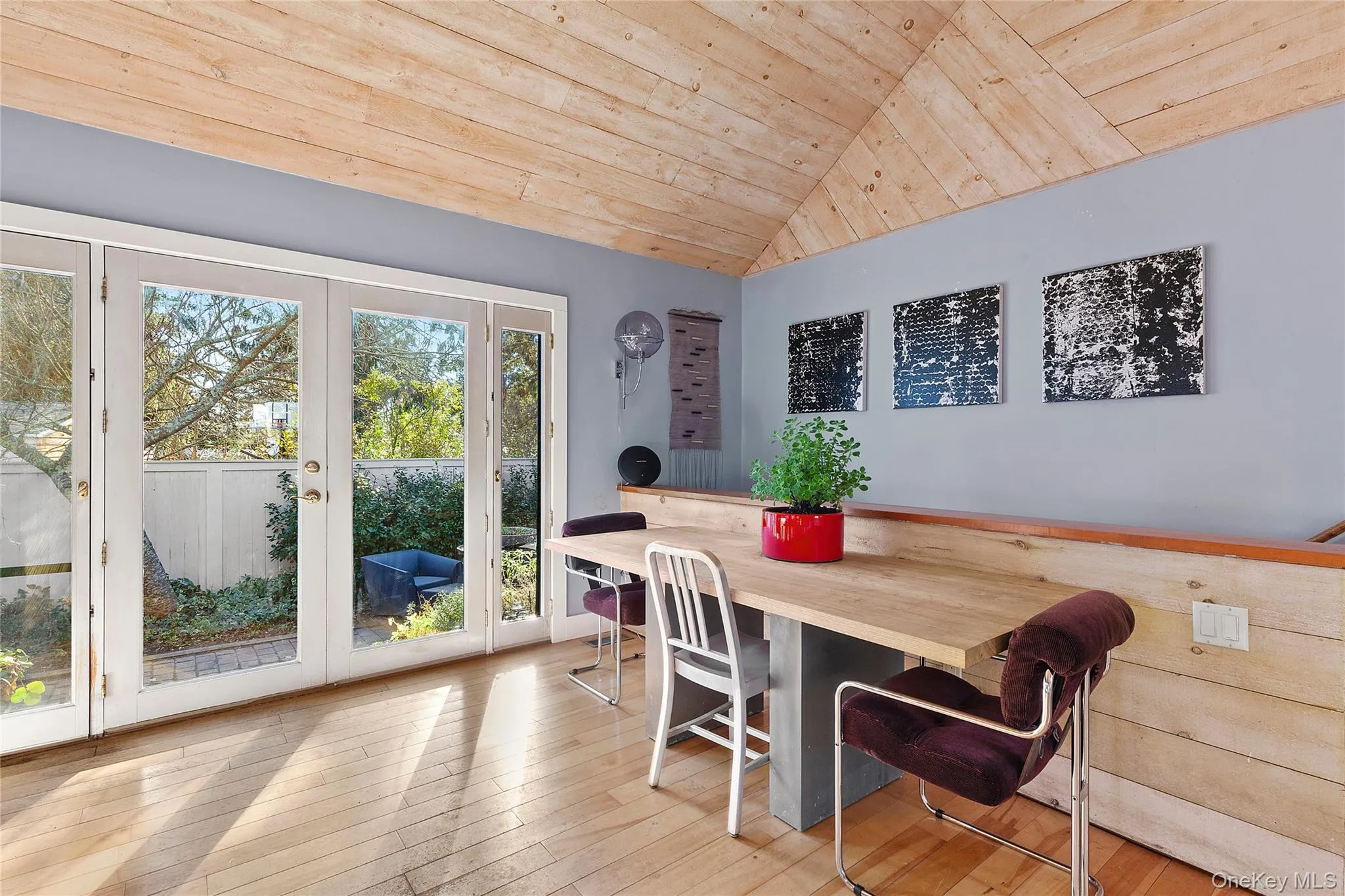 Dining room featuring wood ceiling, lofted ceiling, and light wood-type flooring