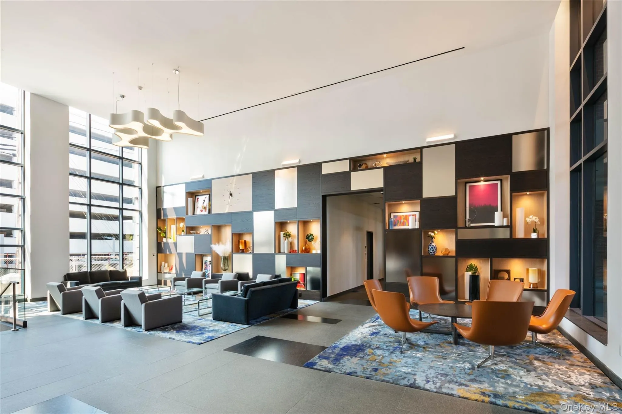 Lobby with expansive windows and a towering ceiling Lobby with expansive windows and a towering ceiling