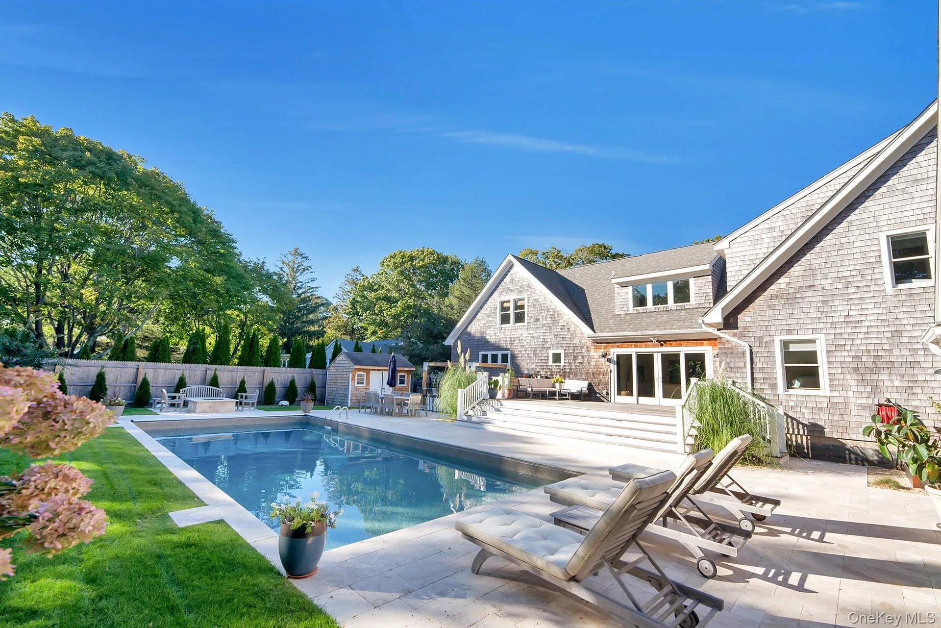 View of swimming pool with a patio, a fenced backyard, a storage shed, and outdoor dining space View of swimming pool with a patio, a fenced backyard, a storage shed, and outdoor dining space