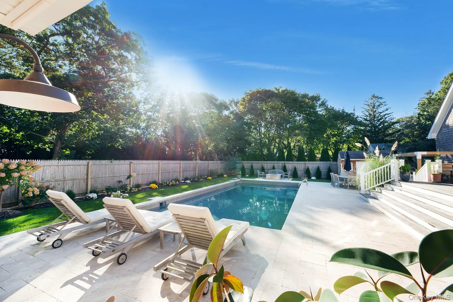 View of swimming pool with a patio area and a fenced backyard View of swimming pool with a patio area and a fenced backyard