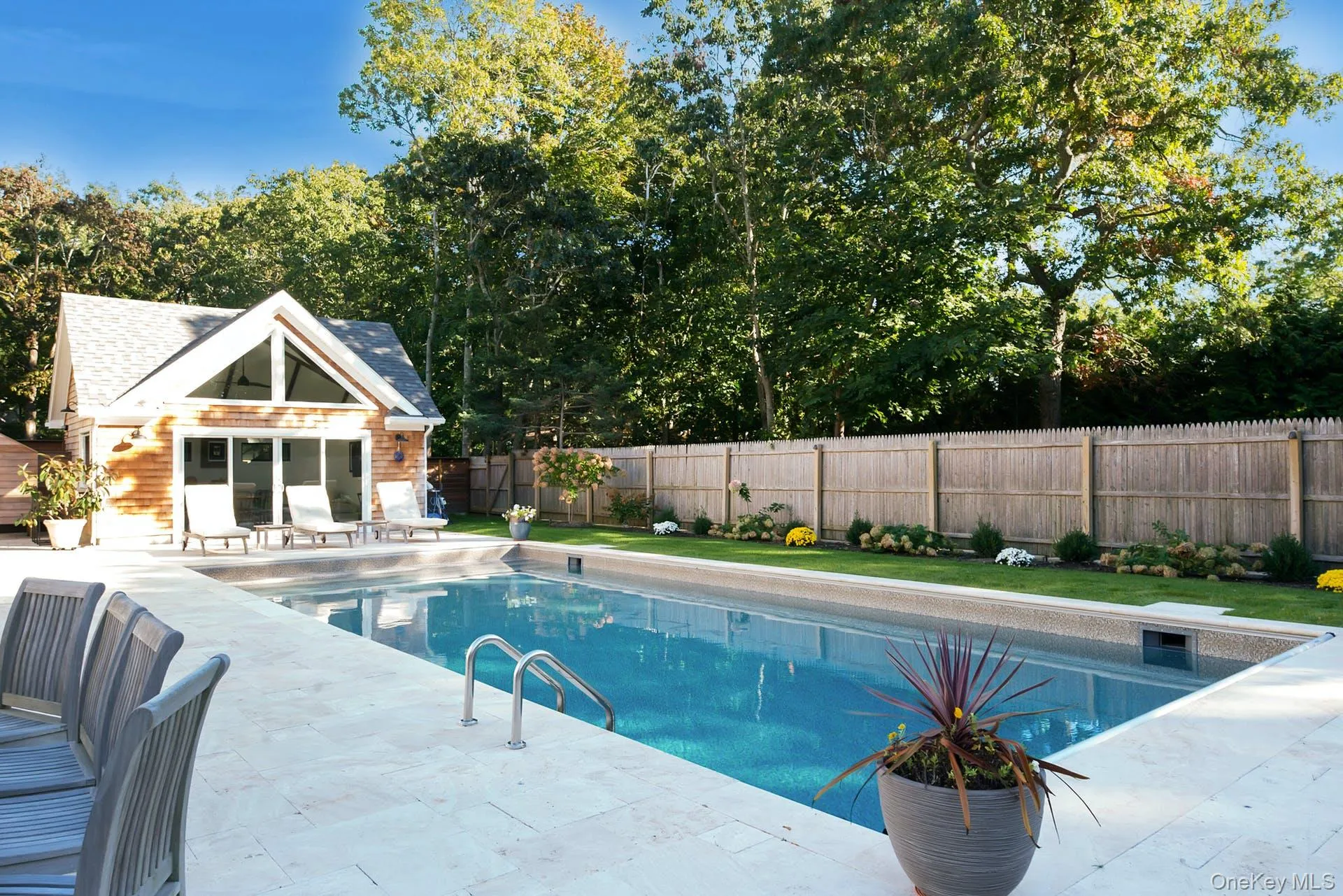 View of pool with a storage structure, an outdoor structure, a patio area, and a fenced backyard View of pool with a storage structure, an outdoor structure, a patio area, and a fenced backyard