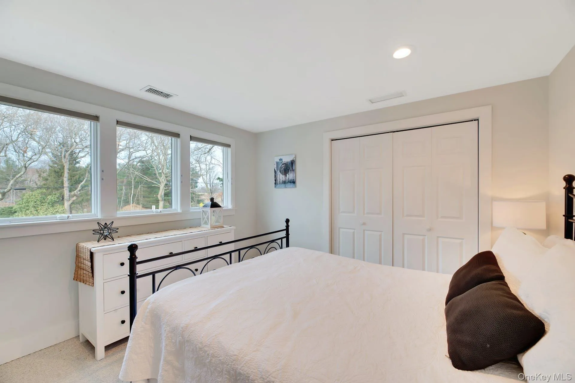 Carpeted bedroom featuring a closet and recessed lighting Carpeted bedroom featuring a closet and recessed lighting