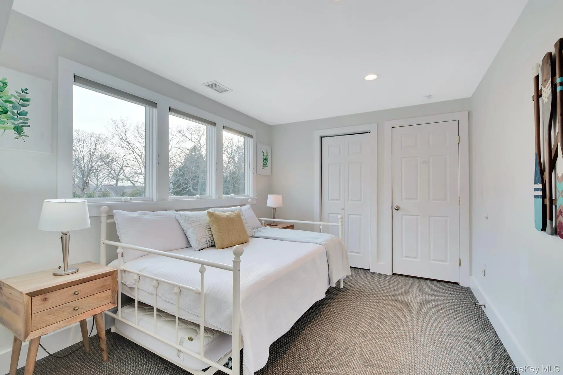 Carpeted bedroom with a closet and recessed lighting Carpeted bedroom with a closet and recessed lighting