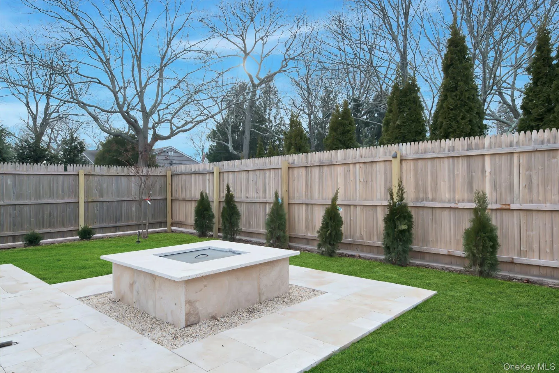 Fenced backyard with a patio Fenced backyard with a patio