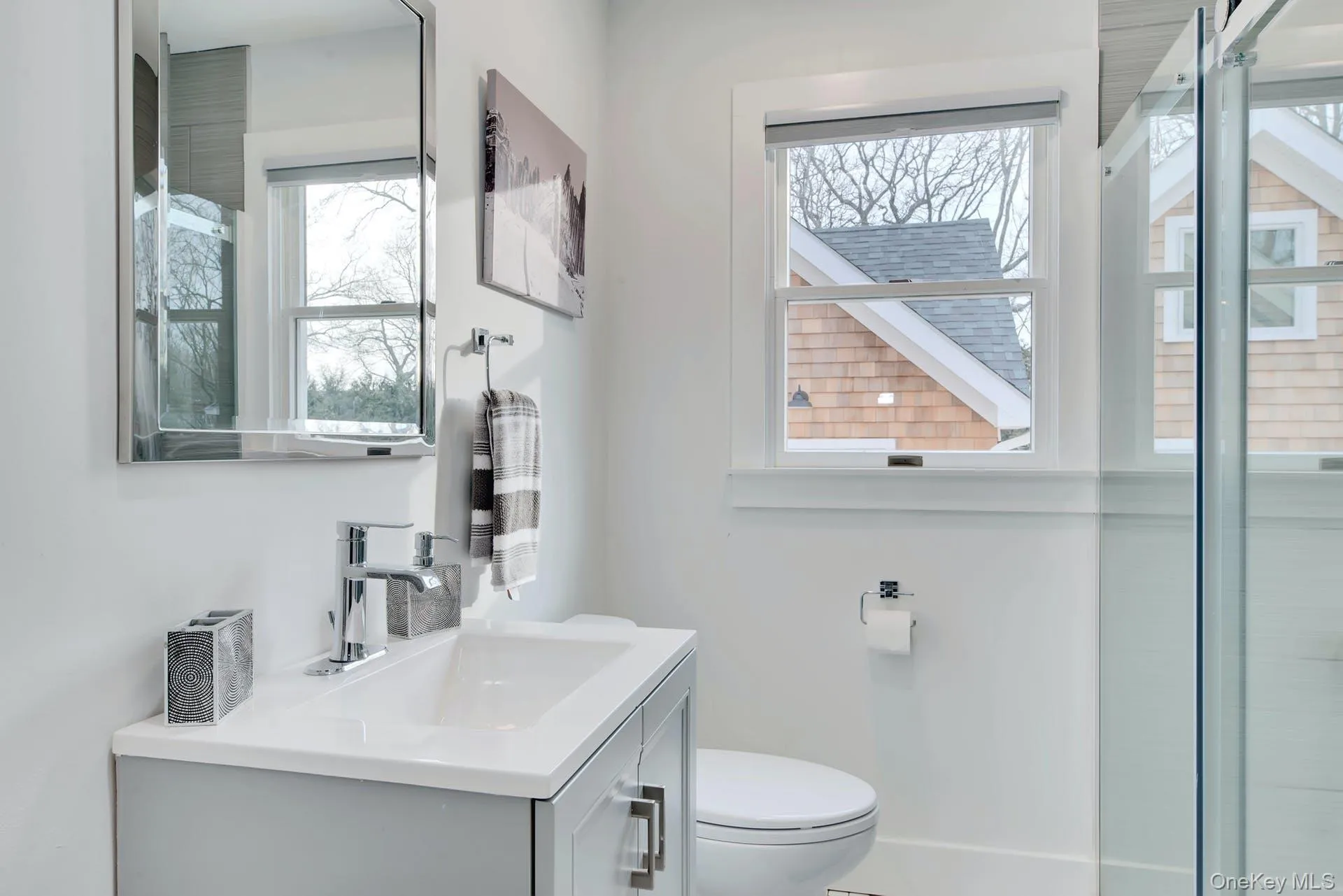 Bathroom with vanity and a shower with shower door Bathroom with vanity and a shower with shower door