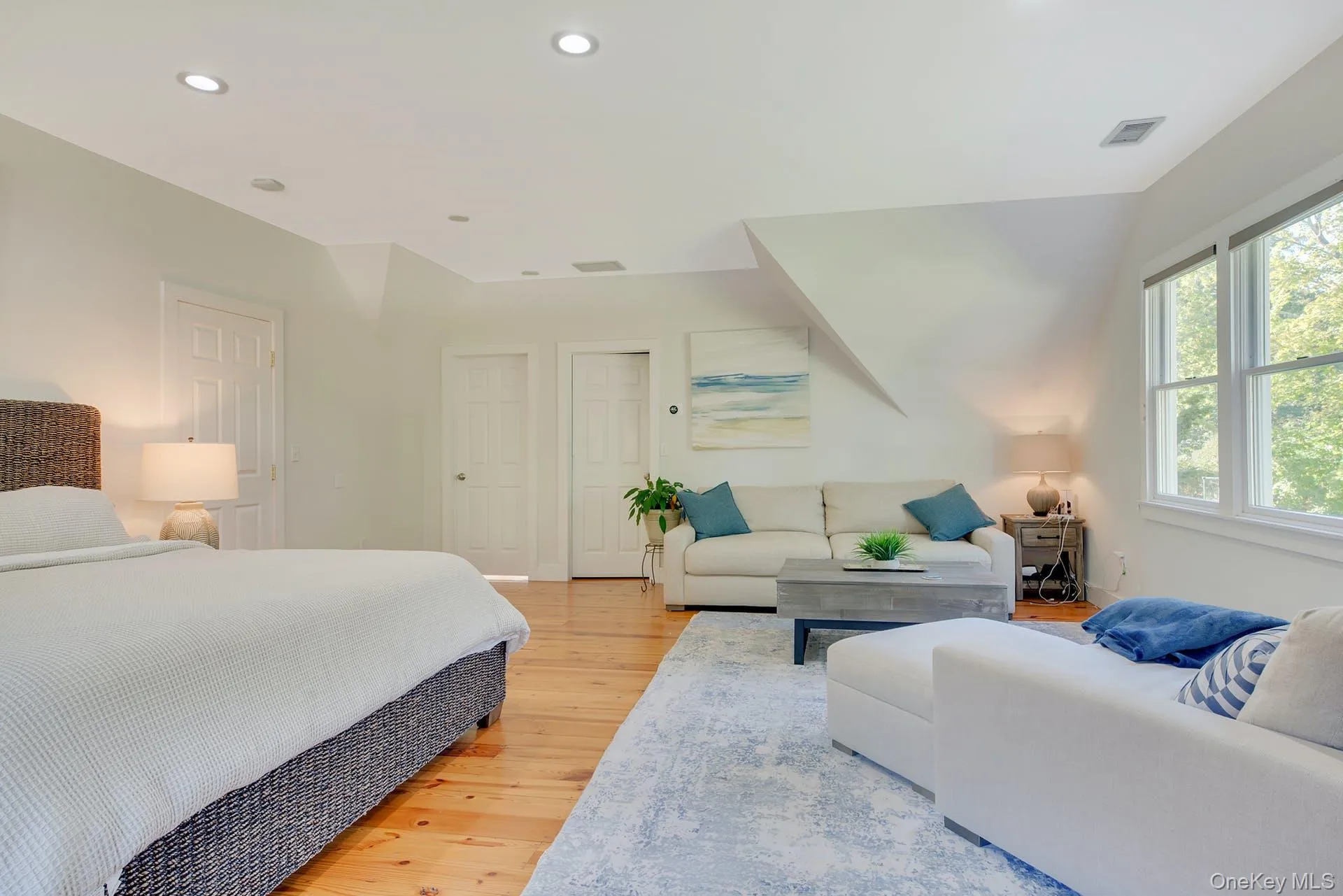 Bedroom featuring recessed lighting and light wood-style floors Bedroom featuring recessed lighting and light wood-style floors