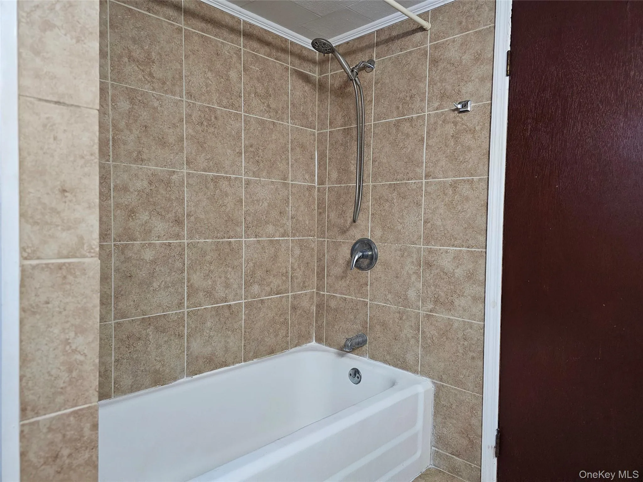 Bathroom featuring bathtub / shower combination Bathroom featuring bathtub / shower combination