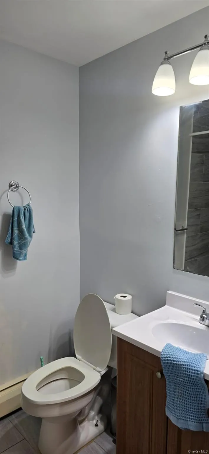 Bathroom featuring vanity and toilet Bathroom featuring vanity and toilet