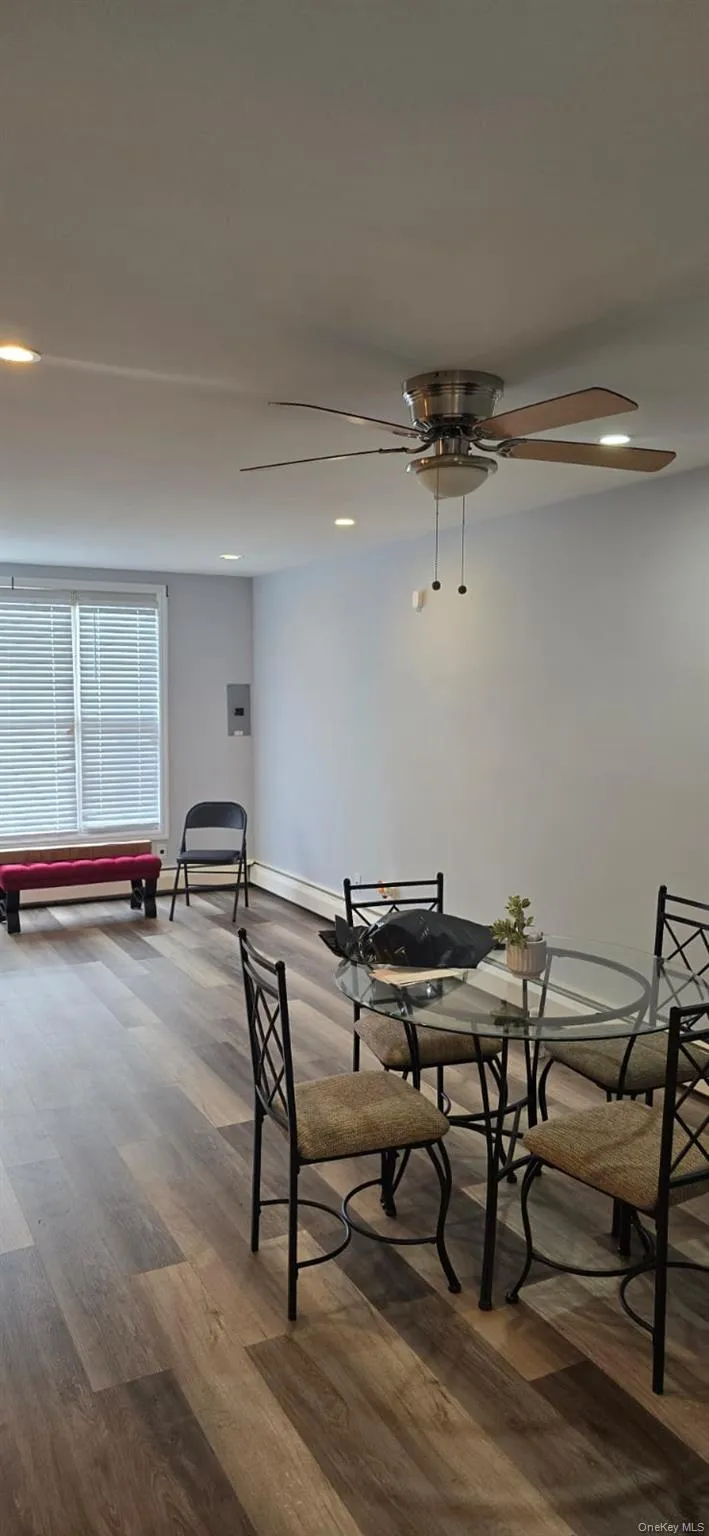 Dining room with recessed lighting, wood finished floors, and ceiling fan Dining room with recessed lighting, wood finished floors, and ceiling fan