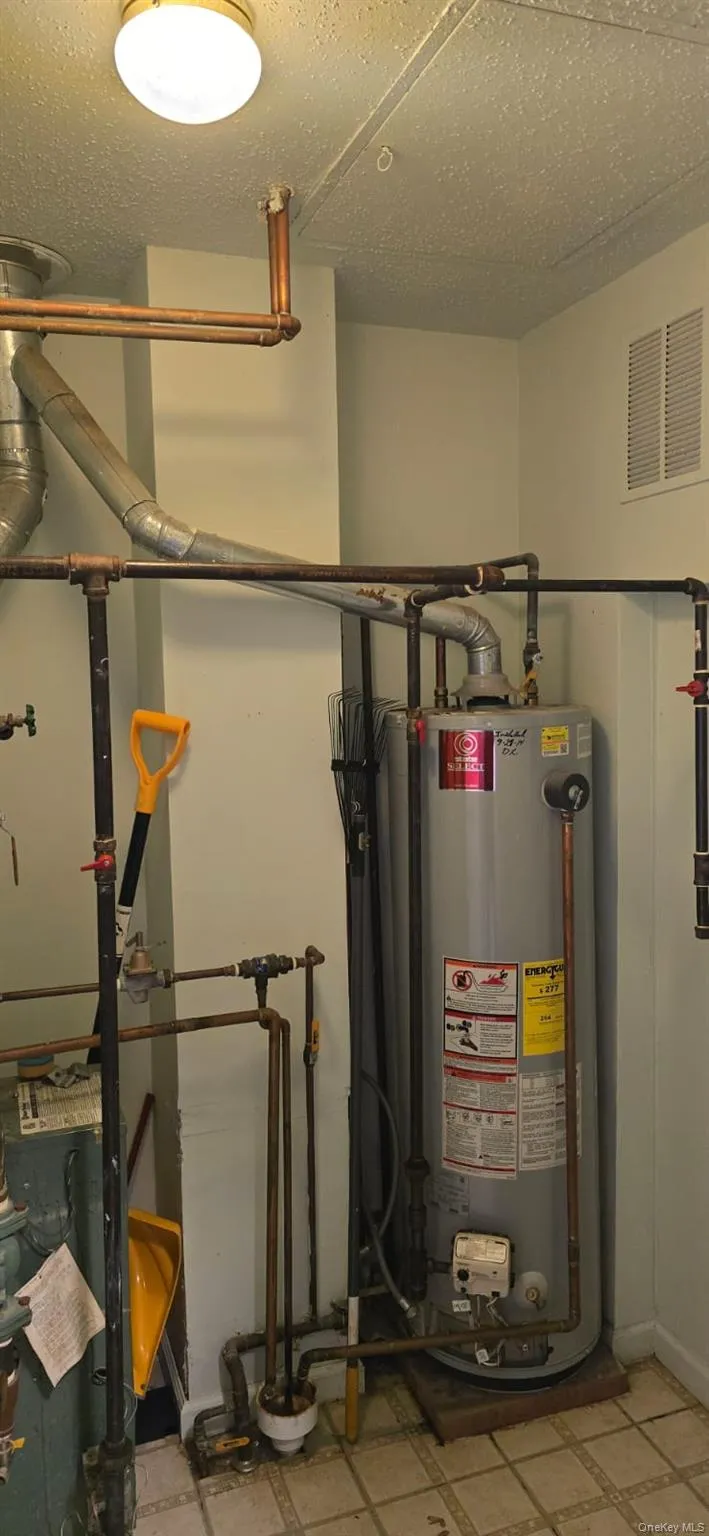 Utilities featuring water heater Utilities featuring water heater