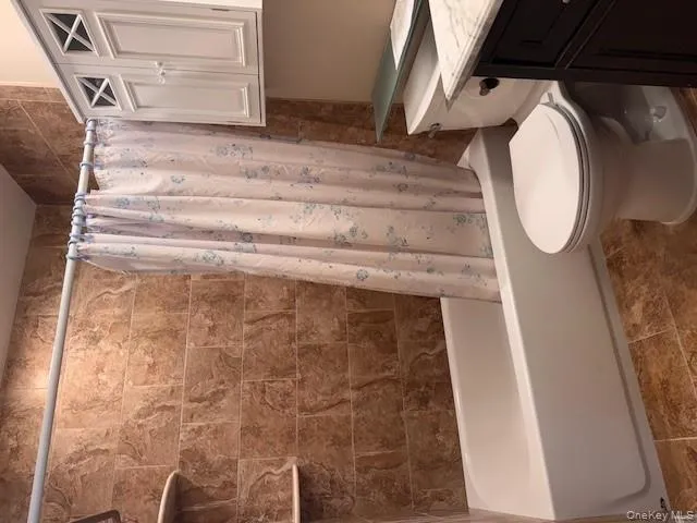 Bathroom with shower / bath combo and vanity Bathroom with shower / bath combo and vanity