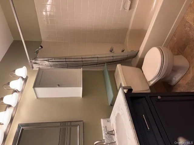 Full bath featuring shower / bath combo and vanity Full bath featuring shower / bath combo and vanity