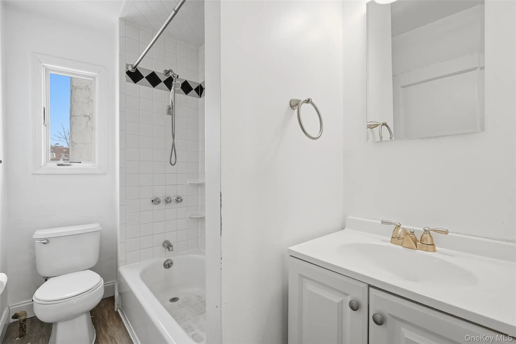 Bathroom with vanity and bathing tub / shower combination Bathroom with vanity and bathing tub / shower combination