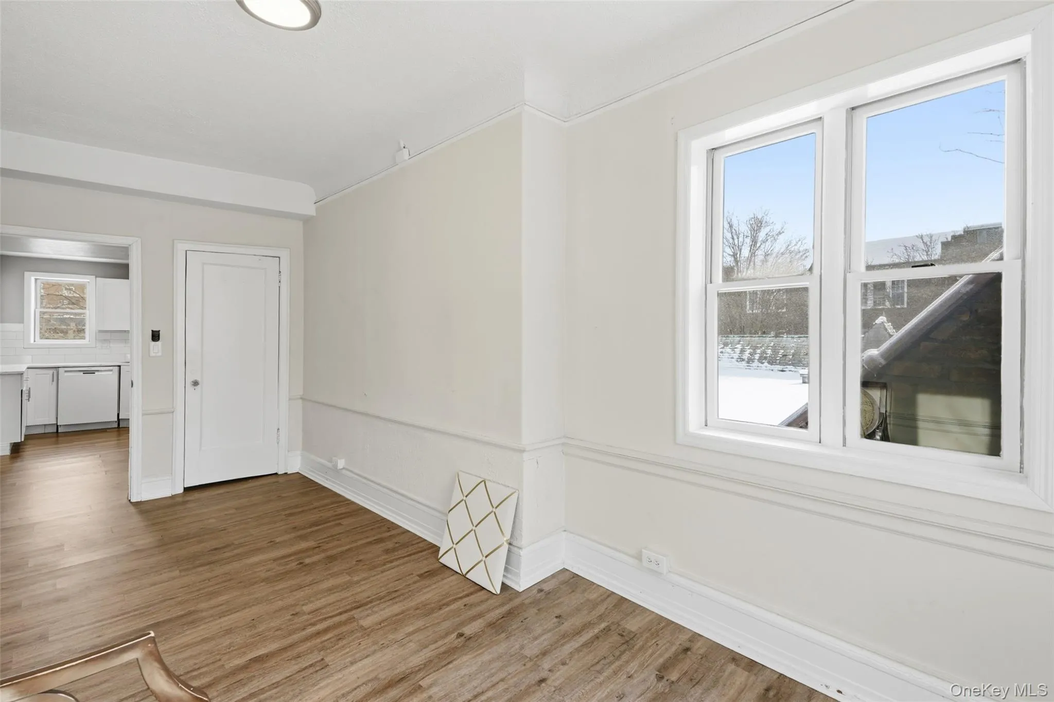 Empty room featuring baseboards and wood finished floors Empty room featuring baseboards and wood finished floors