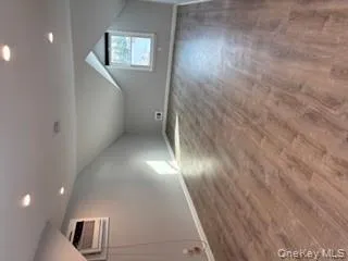 Additional living space featuring lofted ceiling, dark wood finished floors, and recessed lighting Additional living space featuring lofted ceiling, dark wood finished floors, and recessed lighting