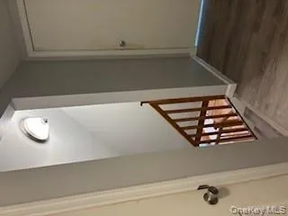 Stairway with wood finished floors and baseboards Stairway with wood finished floors and baseboards