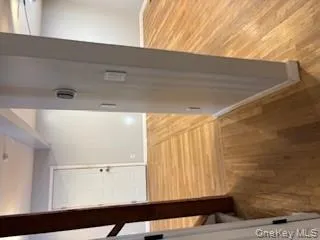 Corridor featuring light wood finished floors and baseboards Corridor featuring light wood finished floors and baseboards