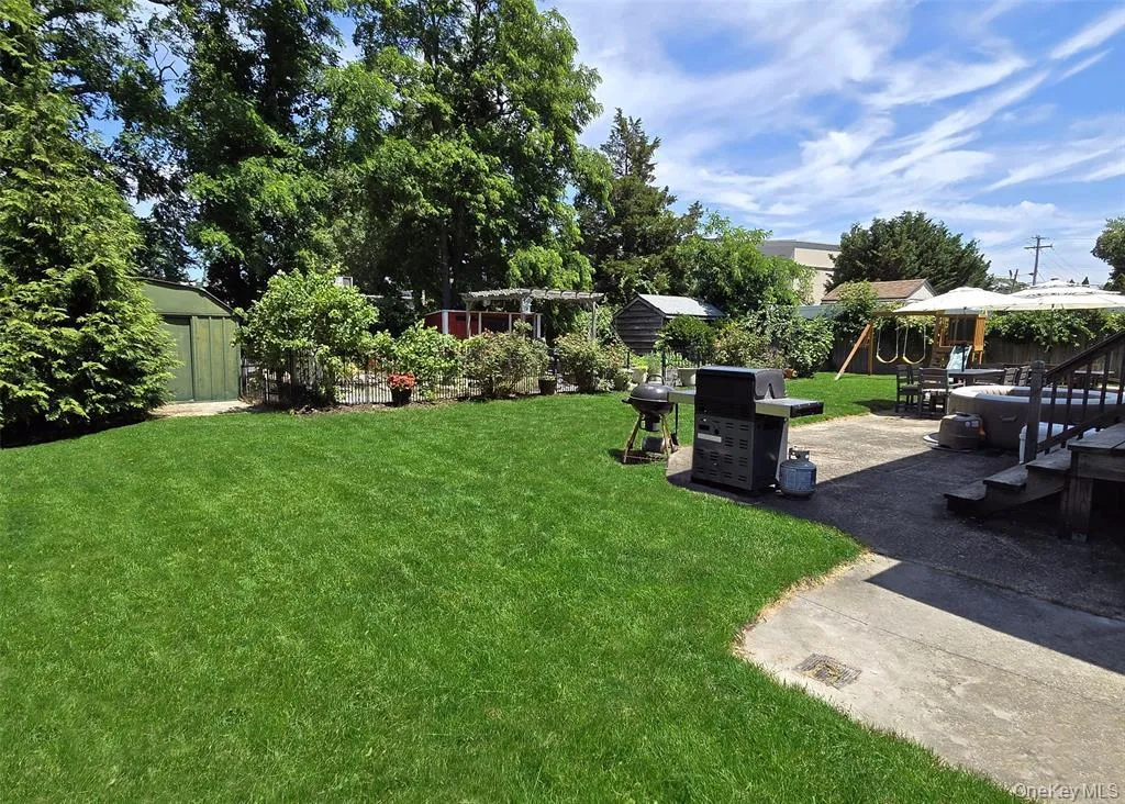 View of yard featuring a playground, a storage shed, and a patio View of yard featuring a playground, a storage shed, and a patio