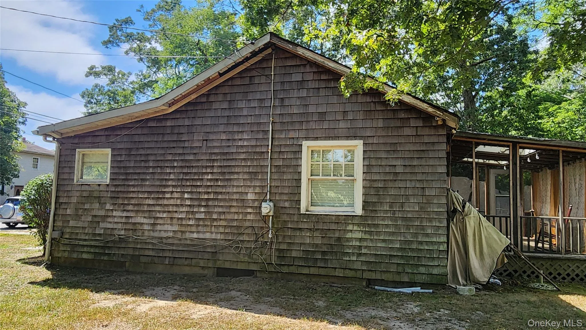 View of property exterior with a wooden deck View of property exterior with a wooden deck
