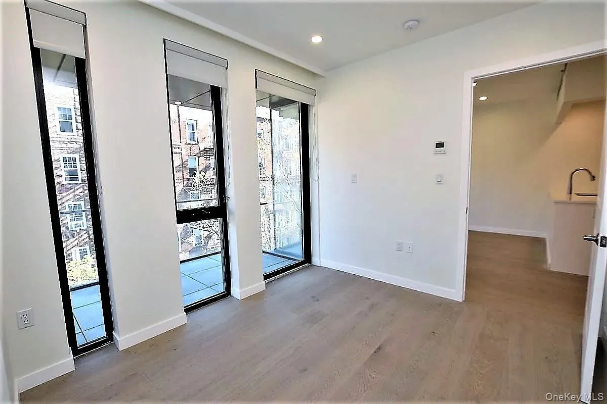 Foyer entrance with plenty of natural light, light wood-style flooring, and recessed lighting Foyer entrance with plenty of natural light, light wood-style flooring, and recessed lighting
