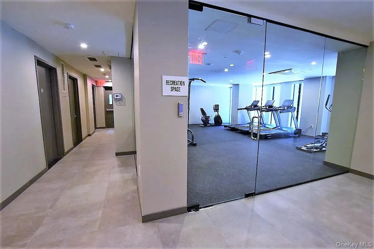 Workout area featuring elevator and recessed lighting Workout area featuring elevator and recessed lighting