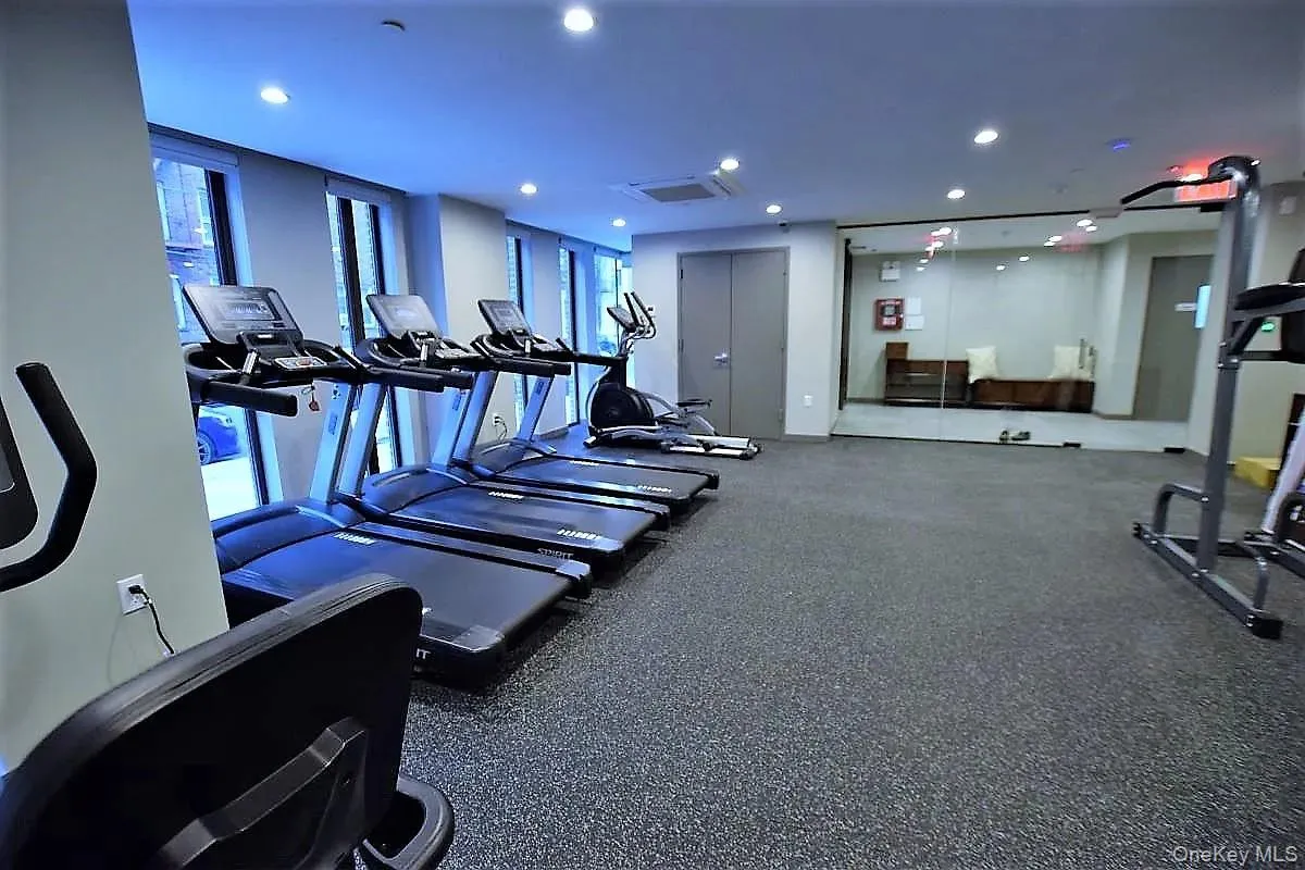 Workout area with recessed lighting and cooling unit Workout area with recessed lighting and cooling unit