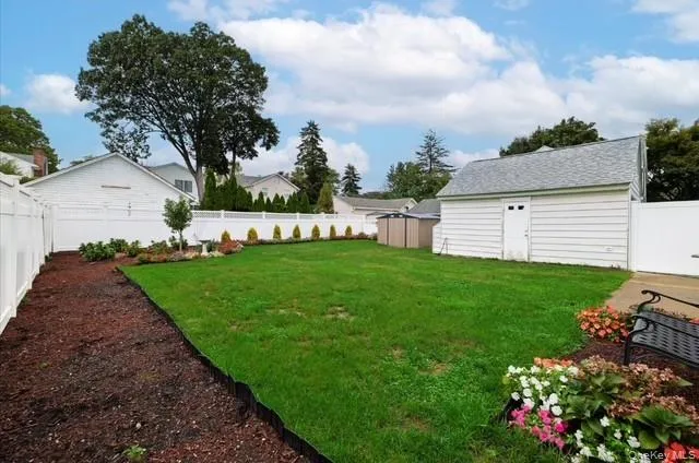Fenced backyard with a shed Fenced backyard with a shed