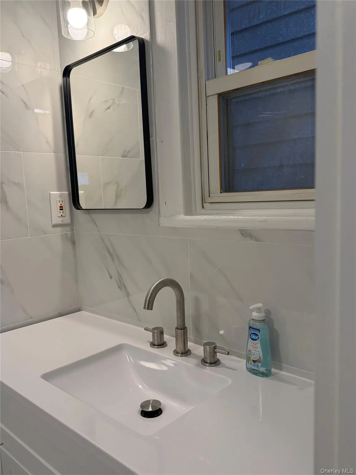 Bathroom view of backsplash and vanity Bathroom view of backsplash and vanity