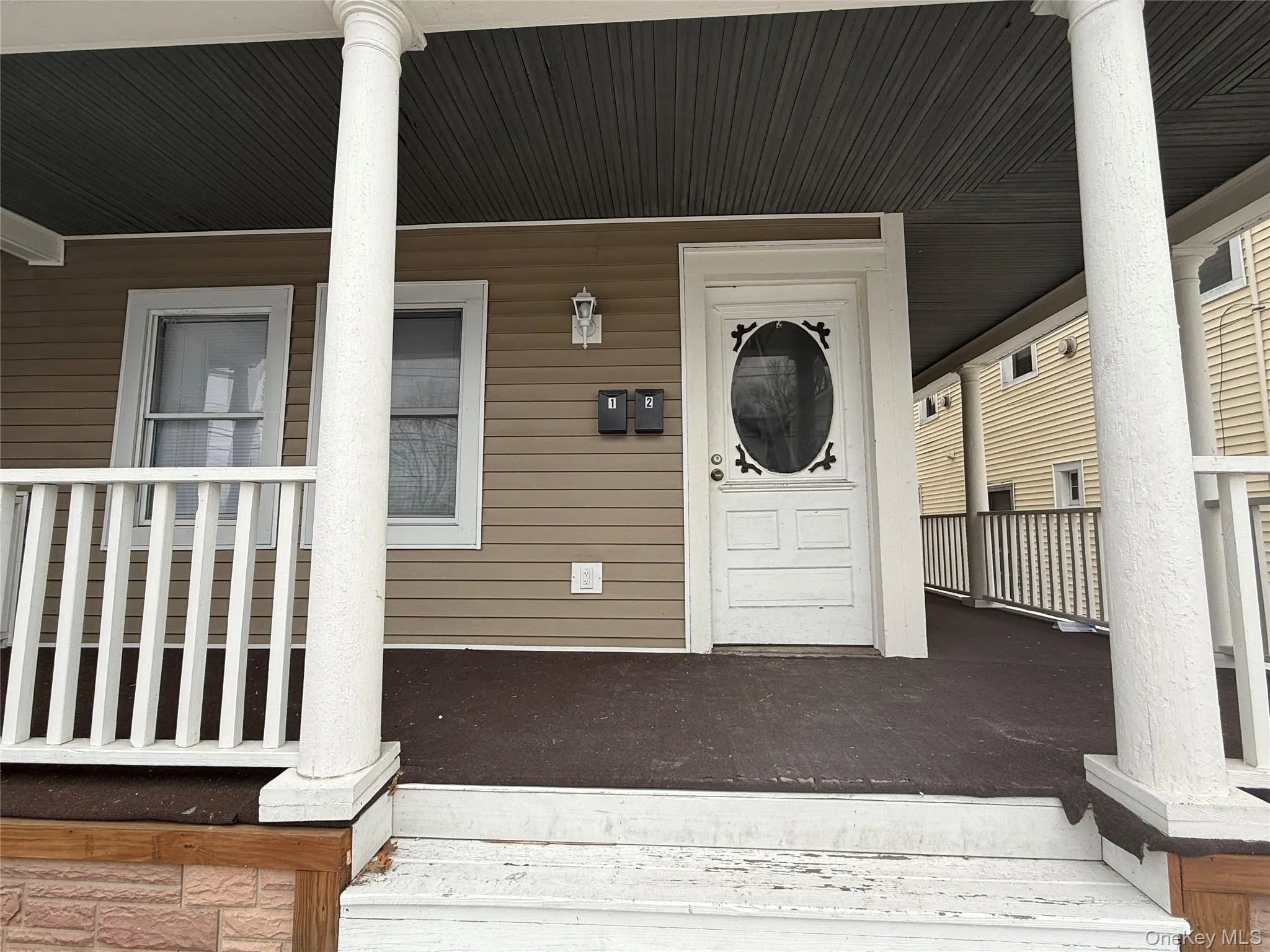 Doorway to property with a porch Doorway to property with a porch