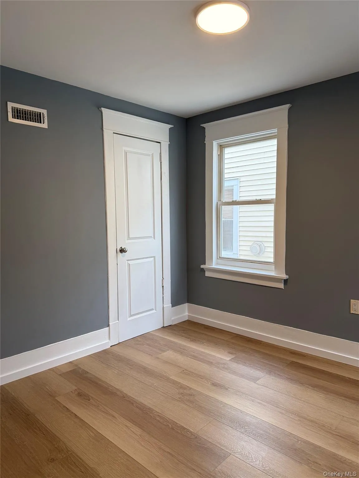 Unfurnished room featuring light wood-style flooring Unfurnished room featuring light wood-style flooring