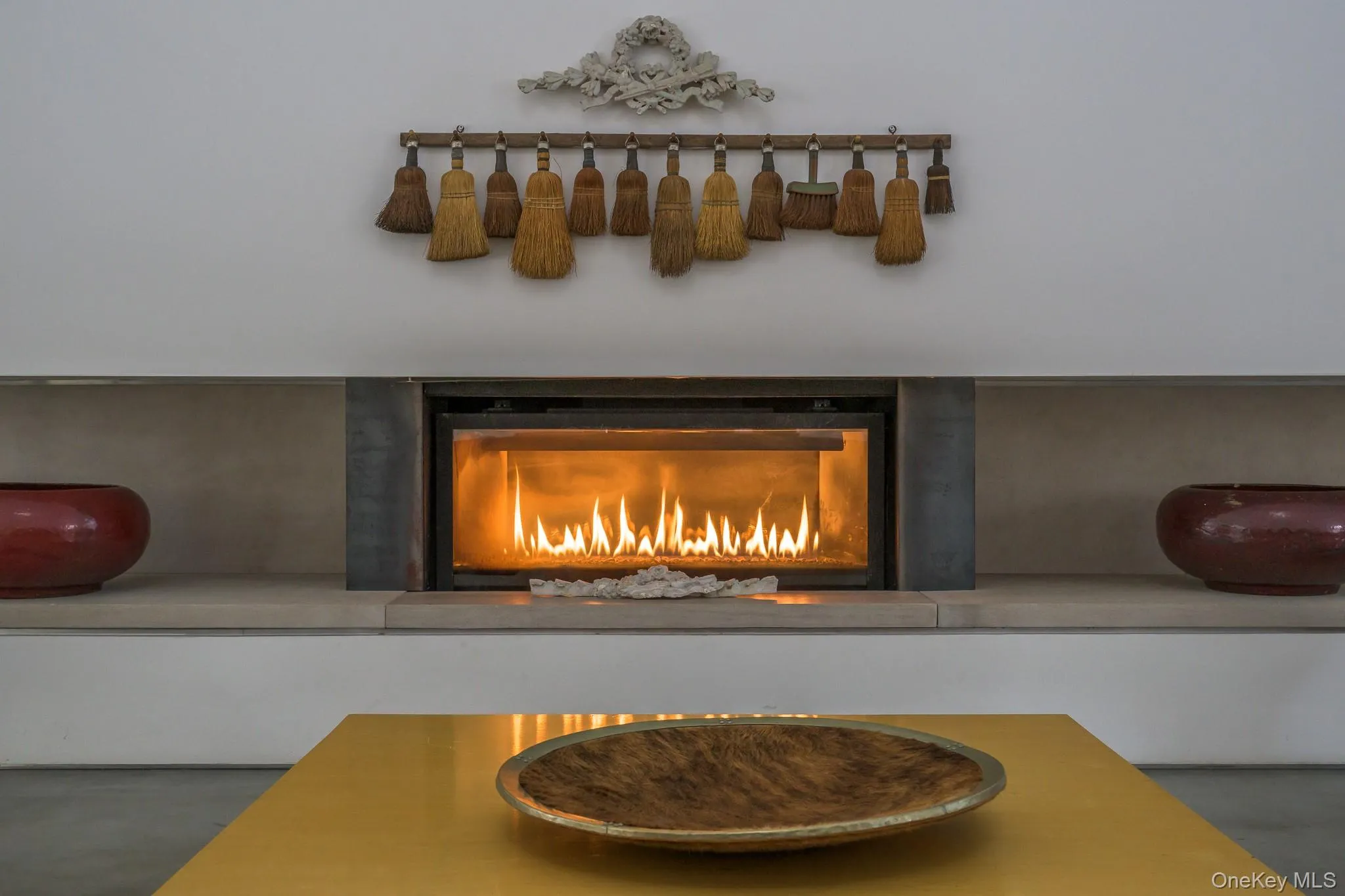 Detailed view of a warm lit fireplace and finished concrete floors Detailed view of a warm lit fireplace and finished concrete floors