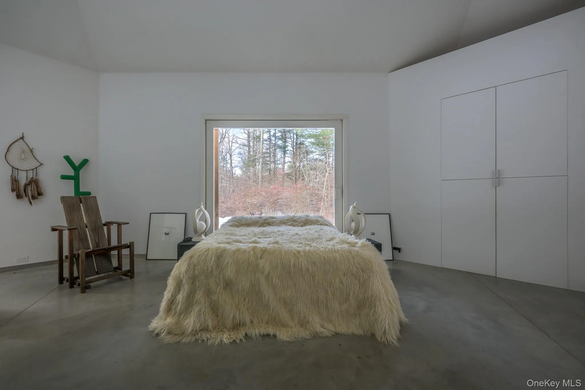 Bedroom with finished concrete floors Bedroom with finished concrete floors