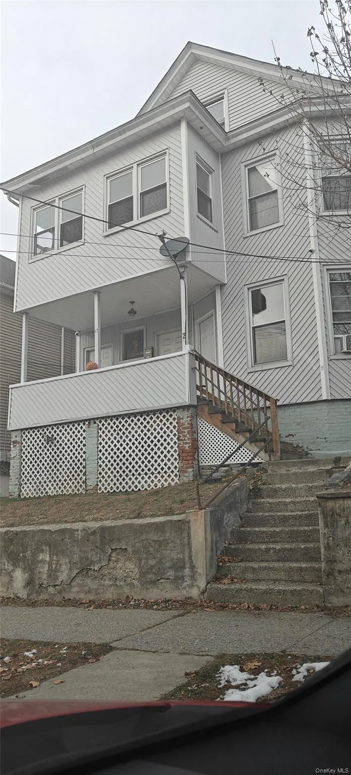 View of front of house with covered porch and stairway View of front of house with covered porch and stairway