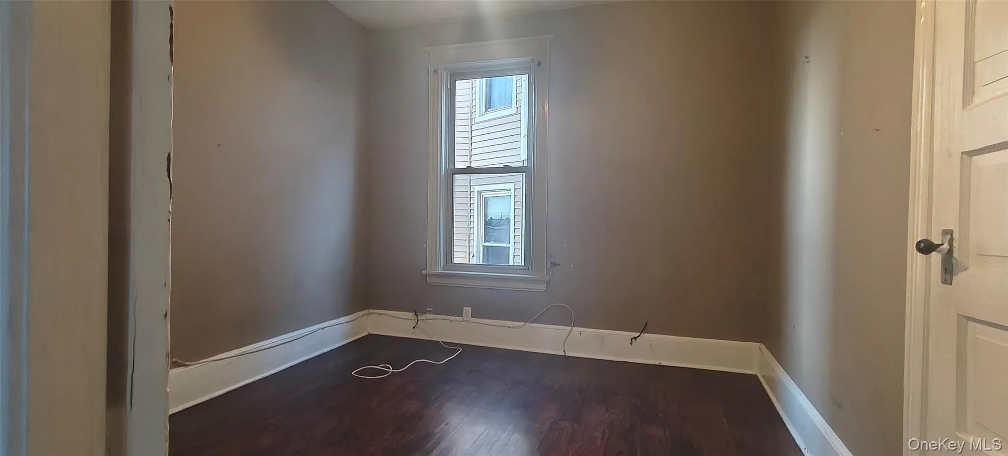 bedroom with baseboards and wood finished floors bedroom with baseboards and wood finished floors
