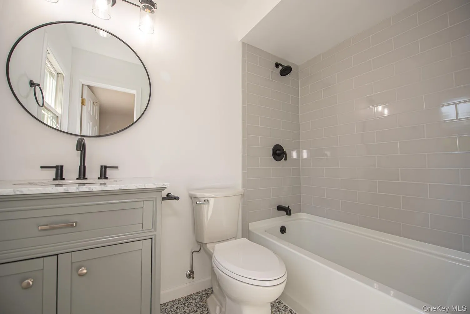 Bathroom featuring vanity and shower / bathtub combination Bathroom featuring vanity and shower / bathtub combination