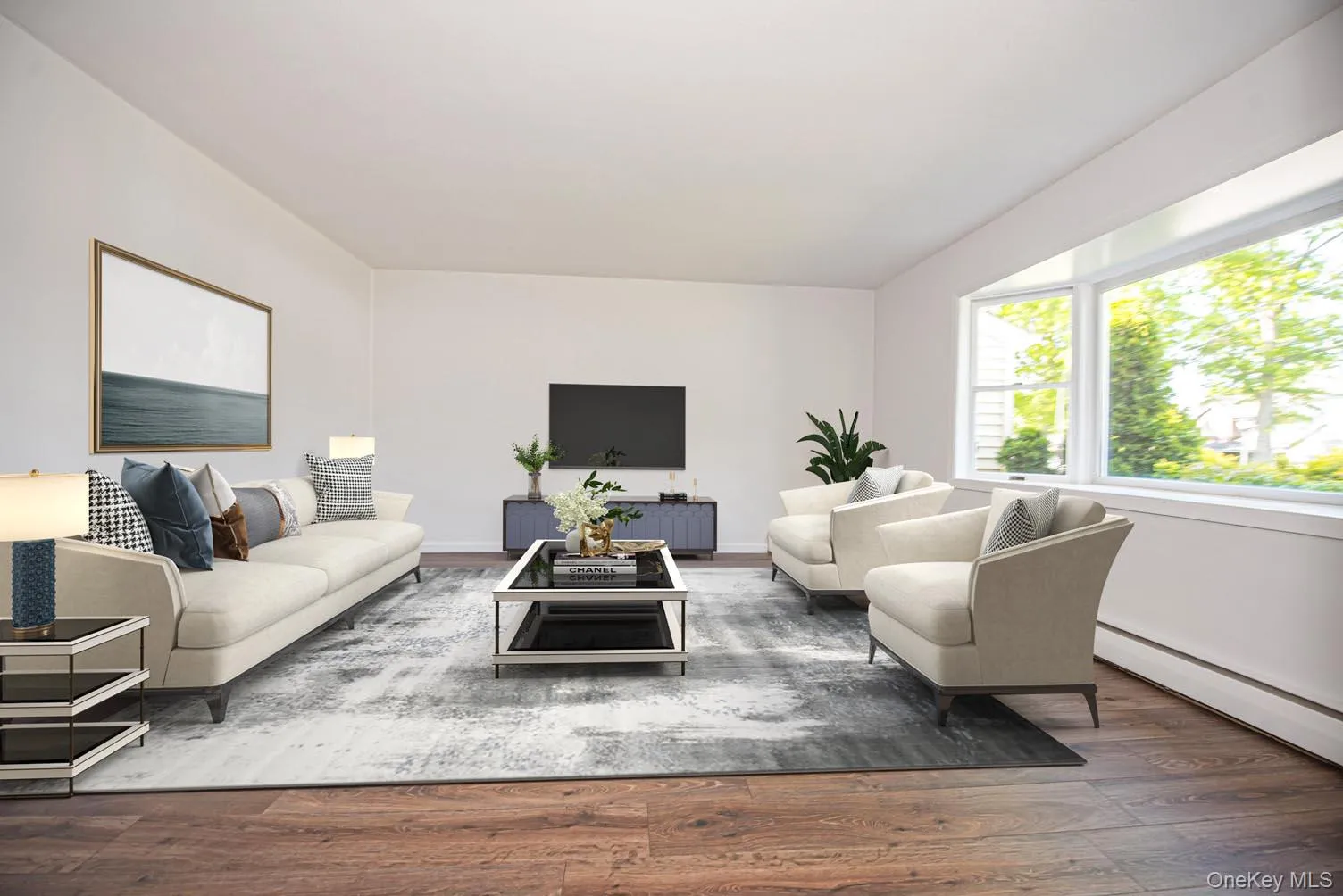 Living area with a baseboard heating unit and wood finished floors Living area with a baseboard heating unit and wood finished floors