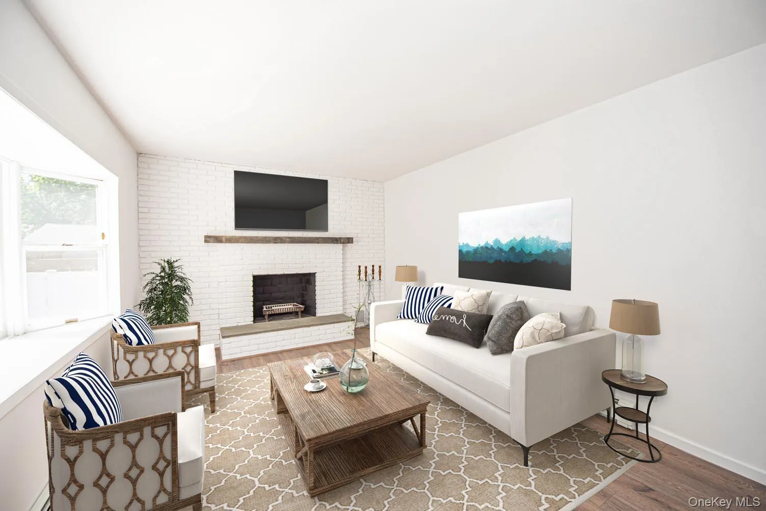 Living area with a fireplace and wood finished floors Living area with a fireplace and wood finished floors