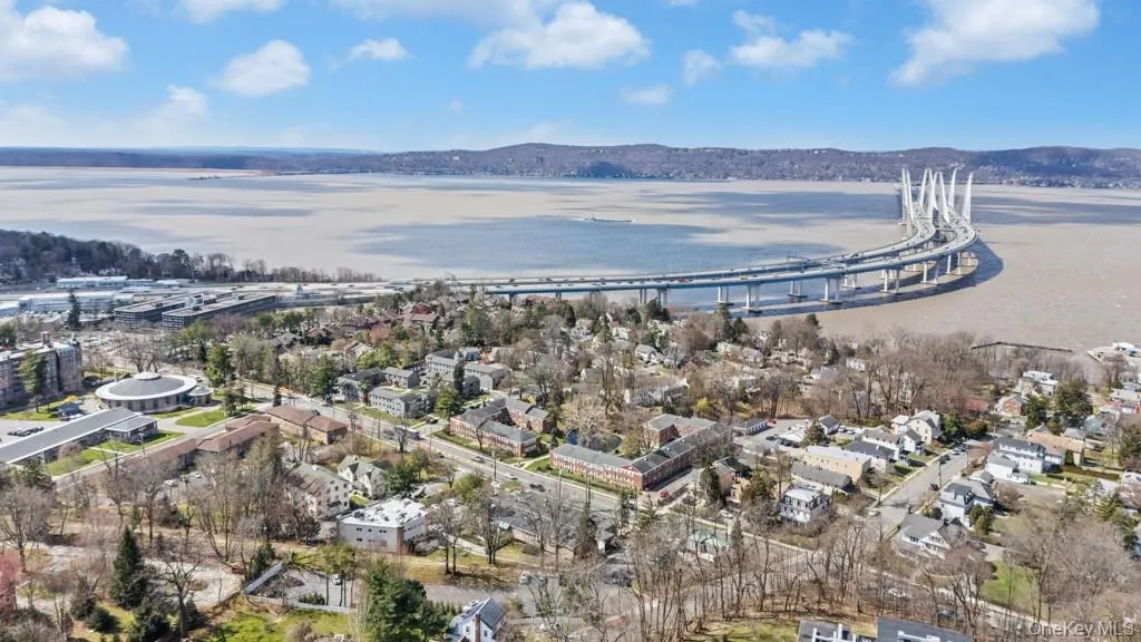 Aerial view of property's location with a notable bridge and a nearby body of water Aerial view of property's location with a notable bridge and a nearby body of water